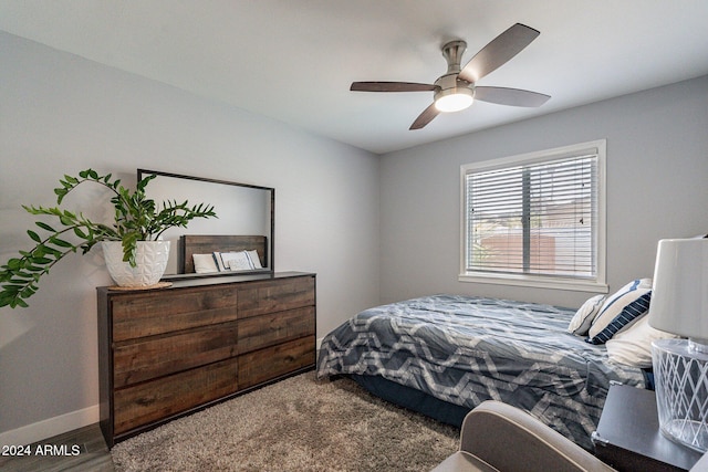 bedroom with baseboards and a ceiling fan