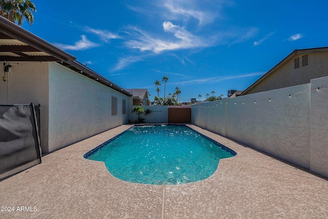 view of pool with a fenced backyard, a fenced in pool, and a patio