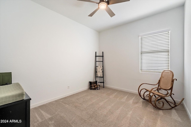 unfurnished room featuring light carpet and ceiling fan