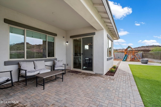 view of patio / terrace featuring outdoor lounge area and a playground