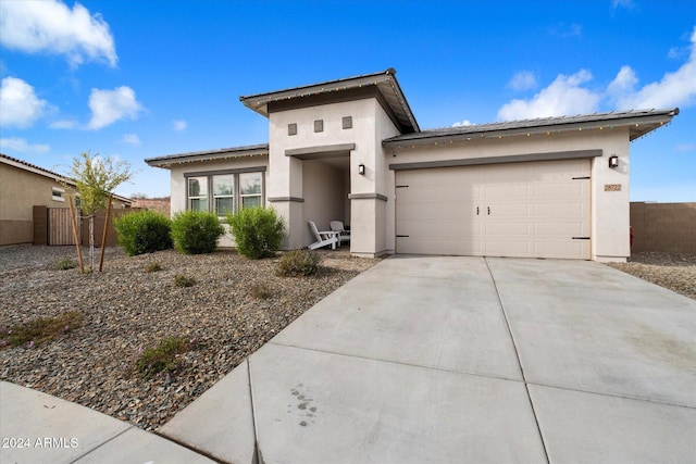 prairie-style house featuring a garage