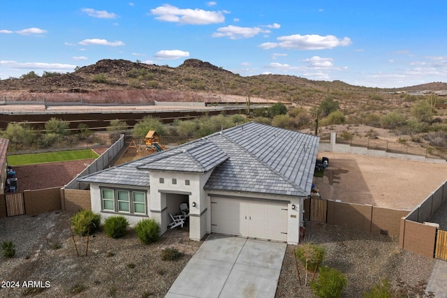 view of front of house with a mountain view and a garage