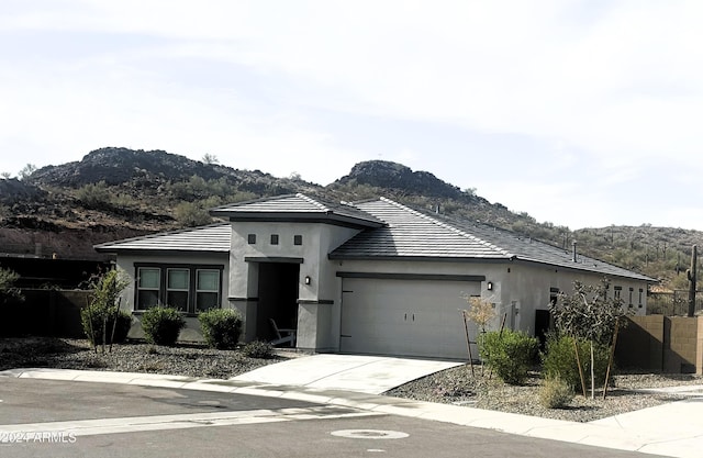 view of front of house featuring a mountain view and a garage