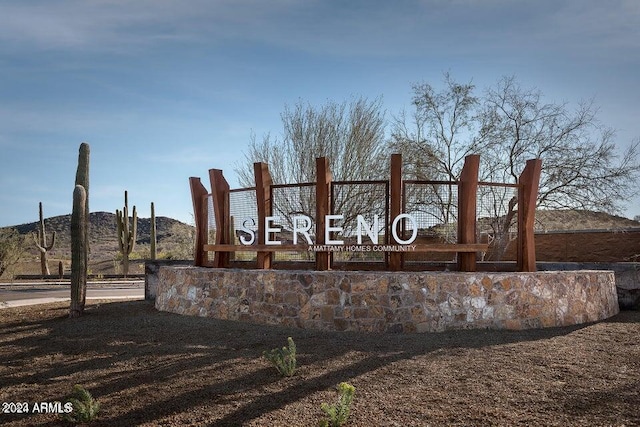 community / neighborhood sign featuring a mountain view