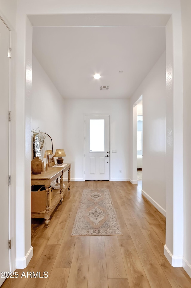 28722 N 133rd Ln, Peoria, AZ 85383 - foyer entrance with baseboards, visible vents, and light wood finished floors