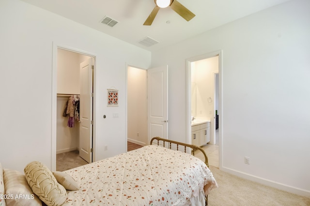 28722 N 133rd Ln, Peoria, AZ 85383 - bedroom featuring visible vents, ensuite bathroom, a spacious closet, and light colored carpet