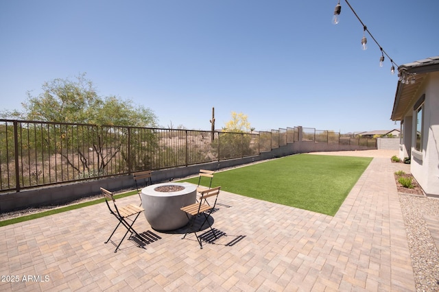 28722 N 133rd Ln, Peoria, AZ 85383 - view of patio / terrace featuring a fenced backyard, a fire pit, and central air condition unit