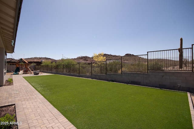 28722 N 133rd Ln, Peoria, AZ 85383 - view of yard with a fenced backyard, a playground, and a patio area