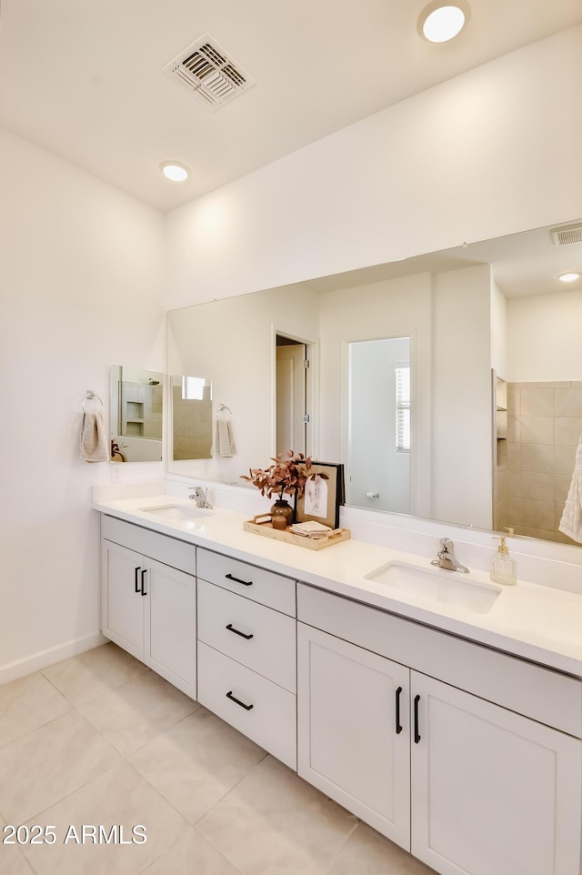 28722 N 133rd Ln, Peoria, AZ 85383 - bathroom featuring double vanity, visible vents, a sink, and tile patterned flooring
