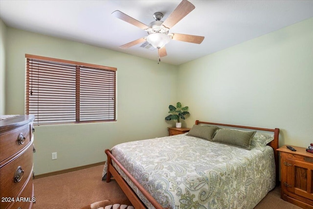 bedroom featuring ceiling fan and light colored carpet