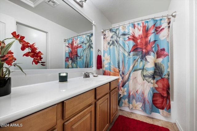 bathroom with vanity, tile patterned flooring, and shower / bathtub combination with curtain