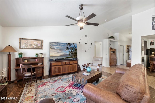 living room featuring ceiling fan, vaulted ceiling, and hardwood / wood-style flooring