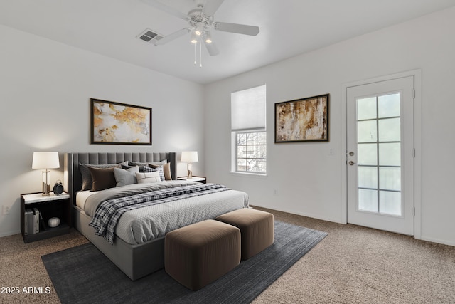 bedroom featuring a ceiling fan, dark carpet, visible vents, and baseboards