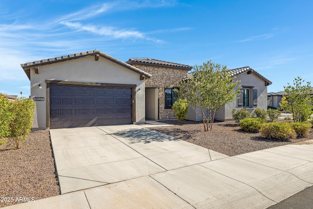 8027 W Northview Ave, Glendale, AZ 85303 - view of front of home with stucco siding, a garage, driveway, and a tile roof