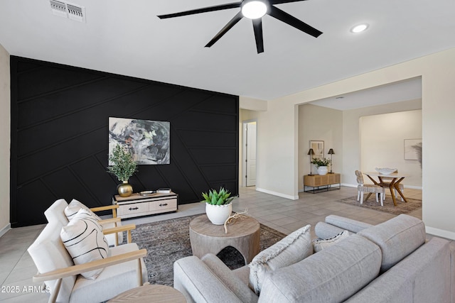 8027 W Northview Ave, Glendale, AZ 85303 - living room featuring ceiling fan, light tile patterned floors, and an accent wall