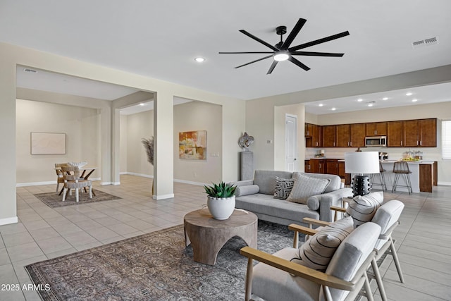 8027 W Northview Ave, Glendale, AZ 85303 - living area featuring light tile patterned floors, ceiling fan, and recessed lighting