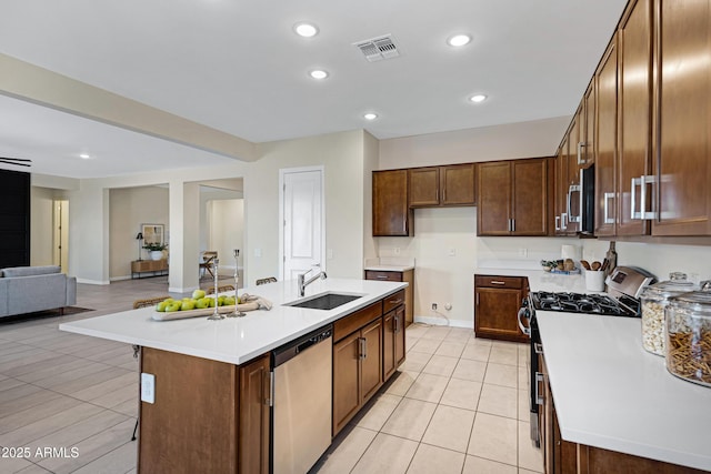 8027 W Northview Ave, Glendale, AZ 85303 - kitchen featuring stainless steel appliances, light countertops, an island with sink, light tile patterned flooring, and recessed lighting
