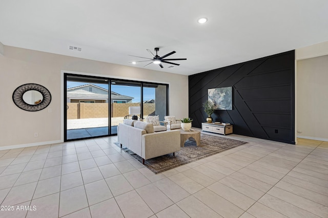 8027 W Northview Ave, Glendale, AZ 85303 - living area with a ceiling fan, light tile patterned floors, an accent wall, and recessed lighting