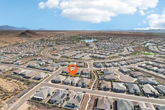 birds eye view of property featuring a mountain view