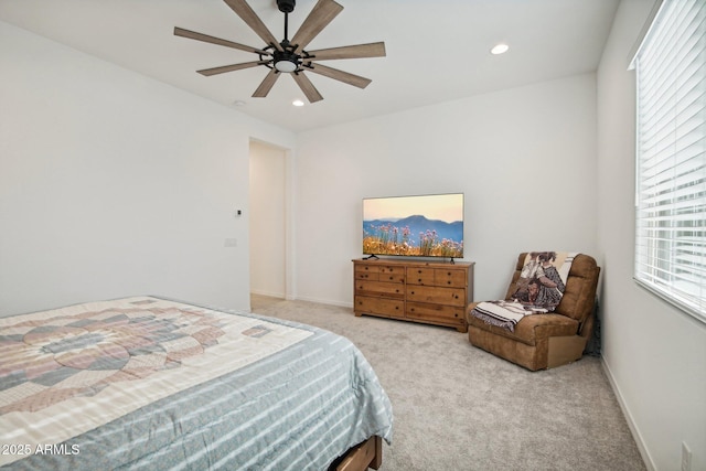 bedroom featuring light carpet and ceiling fan