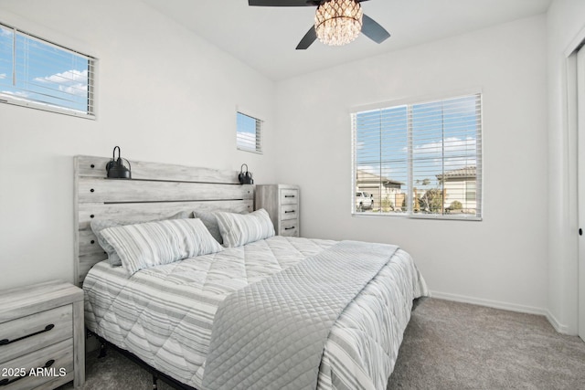 bedroom featuring ceiling fan and carpet