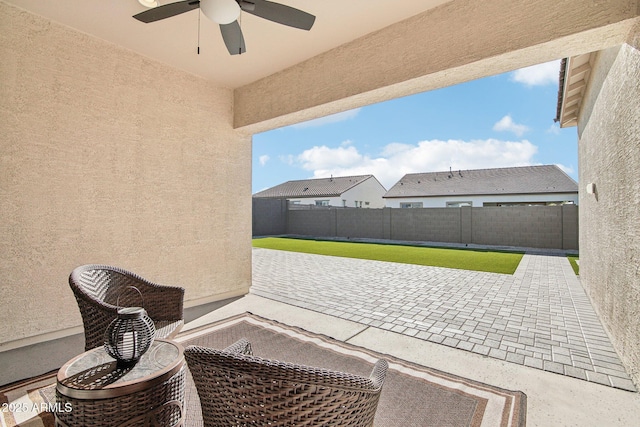 view of patio featuring ceiling fan