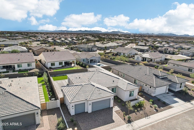 birds eye view of property featuring a mountain view