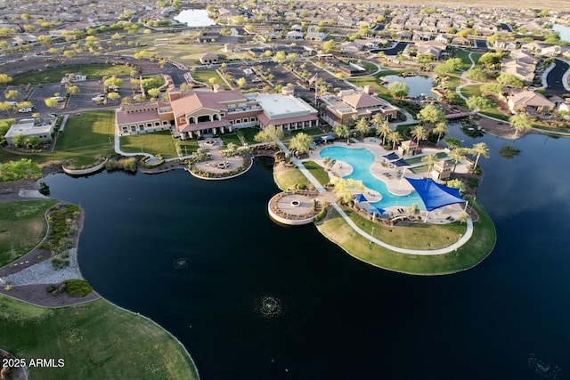 birds eye view of property with a water view