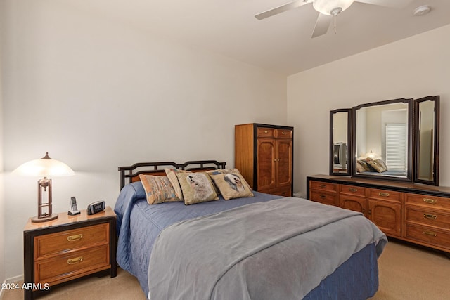 bedroom with light carpet and ceiling fan