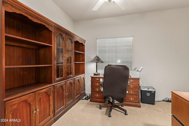 carpeted office space with ceiling fan and visible vents