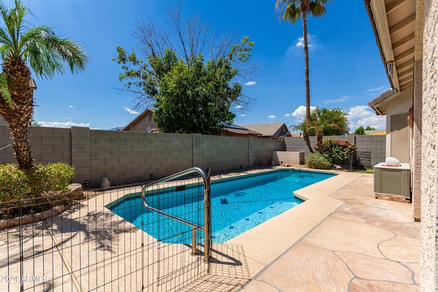 view of swimming pool with a patio area, a fenced backyard, and a fenced in pool