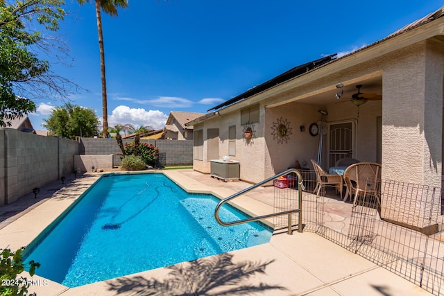 view of pool featuring a fenced in pool, a fenced backyard, a patio, and ceiling fan