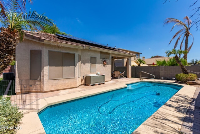 view of pool featuring fence, a fenced in pool, and a patio