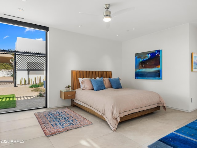 bedroom with expansive windows, access to outside, multiple windows, and a ceiling fan