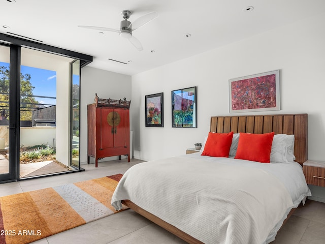 bedroom featuring access to outside and floor to ceiling windows