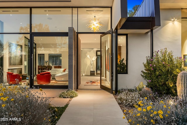 entrance to property with stucco siding