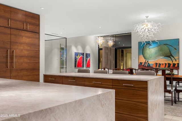 bathroom featuring an inviting chandelier