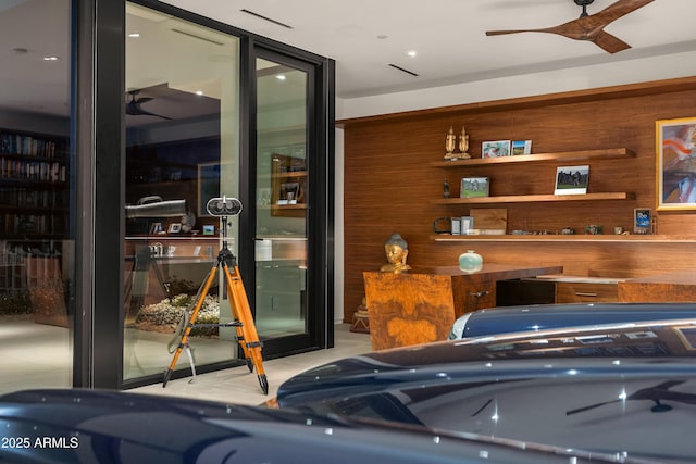 interior space featuring visible vents and a ceiling fan