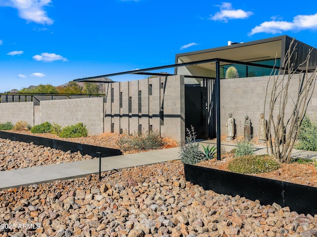 view of home's exterior featuring fence