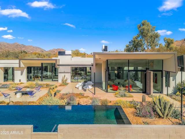 rear view of property featuring a mountain view