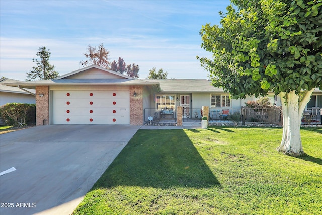 ranch-style home featuring a front lawn and a garage