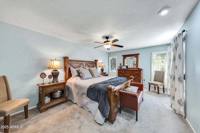 bedroom featuring light colored carpet and ceiling fan
