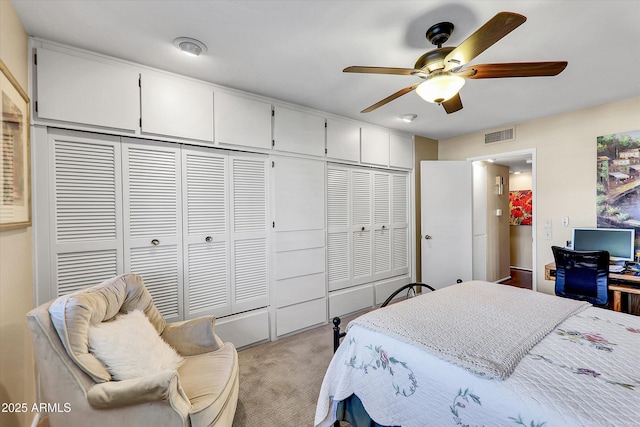 carpeted bedroom with a closet and ceiling fan