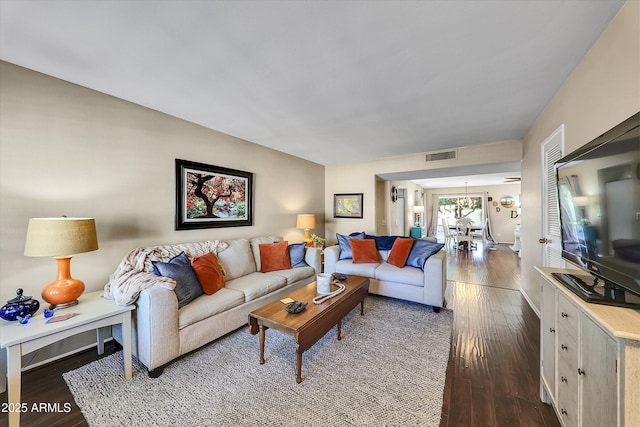 living room featuring dark hardwood / wood-style flooring
