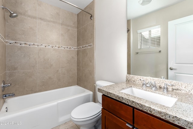 full bathroom featuring vanity, toilet, and tiled shower / bath