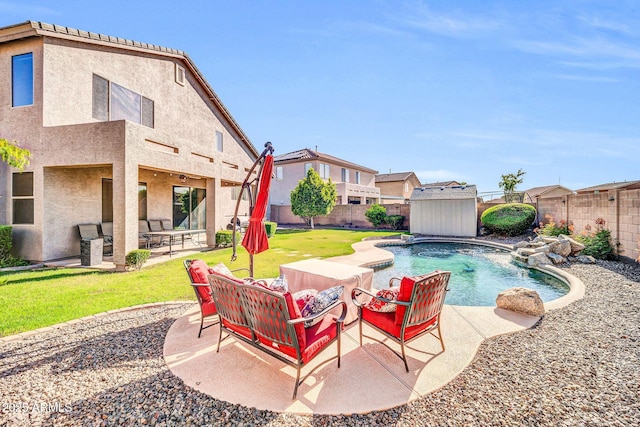 4408 W Summerside Rd, Laveen, AZ 85339 - view of swimming pool featuring outdoor lounge area, a storage shed, and a fenced backyard
