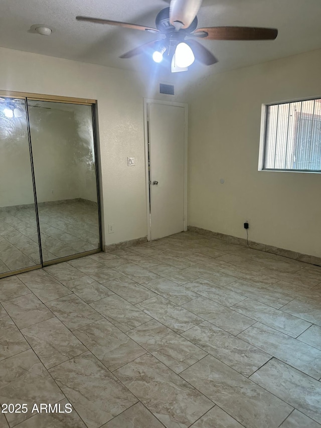 8110 N 31st Dr, Phoenix, AZ 85051 - unfurnished bedroom featuring a closet and a ceiling fan