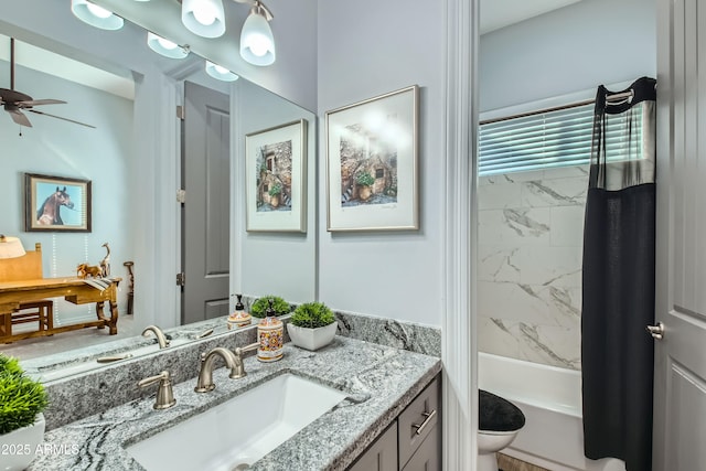 bathroom featuring toilet, shower / bath combo, ceiling fan, and vanity