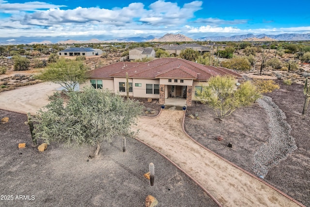 birds eye view of property with a mountain view