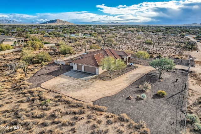 drone / aerial view featuring a mountain view